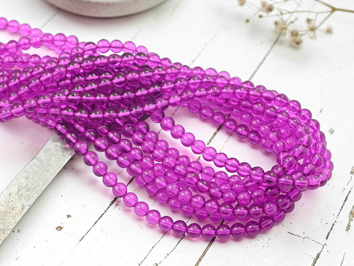 *50* 6mm Translucent Fuchsia Round Druk Beads