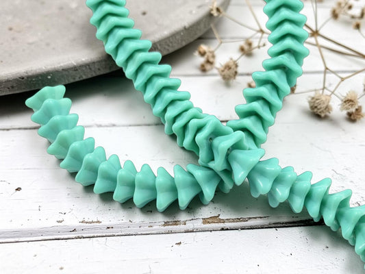 opaque turquoise strand of trumpet bell flower beads
