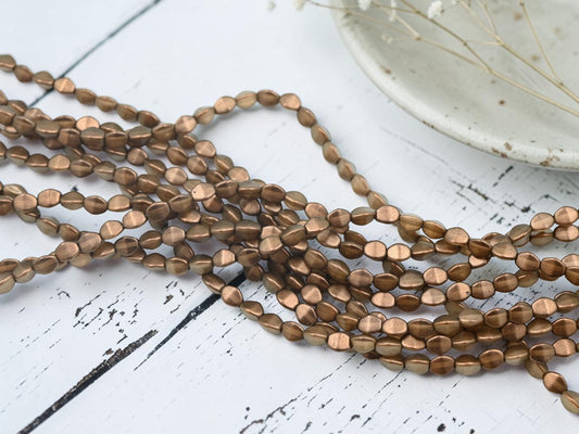 *35* 5x3mm Bronze Halo Pinch Beads
