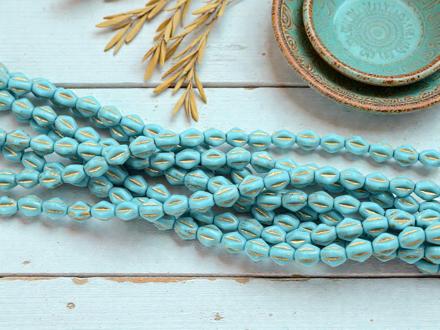 *26* 5x8mm Gold Washed Aero Blue Dented Oval Beads