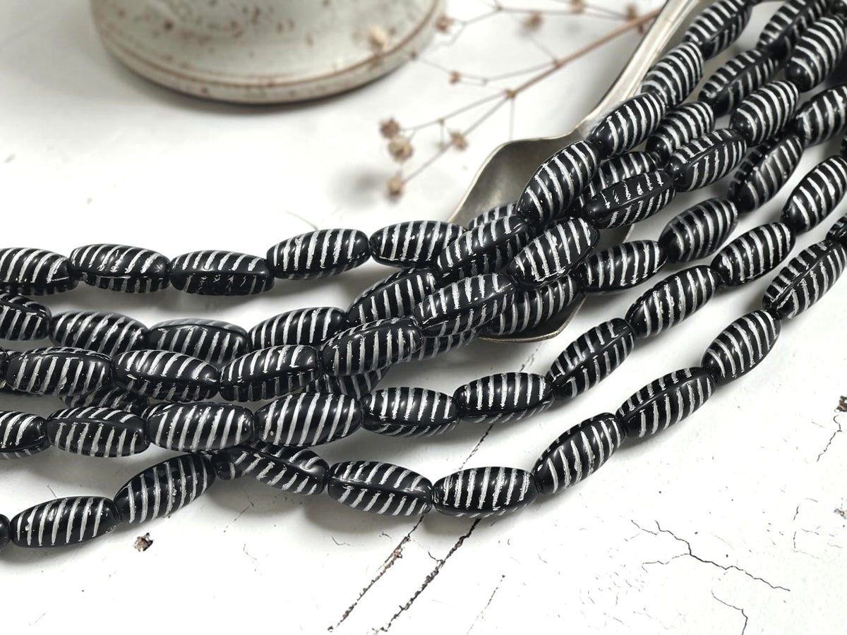 *14* 14x7mm White Washed Jet Black Oval Beads