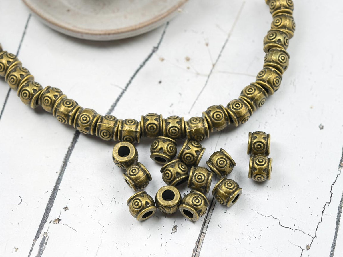 *34* 6x7mm Antique Bronze Barrel Beads