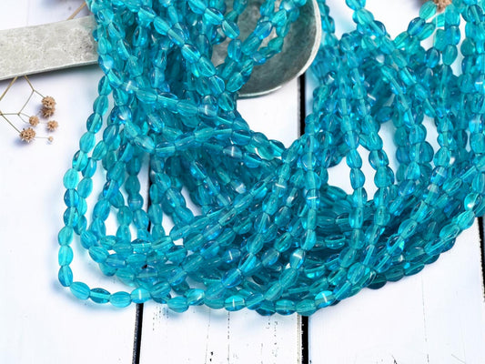 *50* 5x3mmn Capri Blue Pinch Beads
