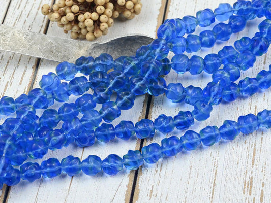 *15* 9mm Translucent Sapphire Barouque Round Beads
