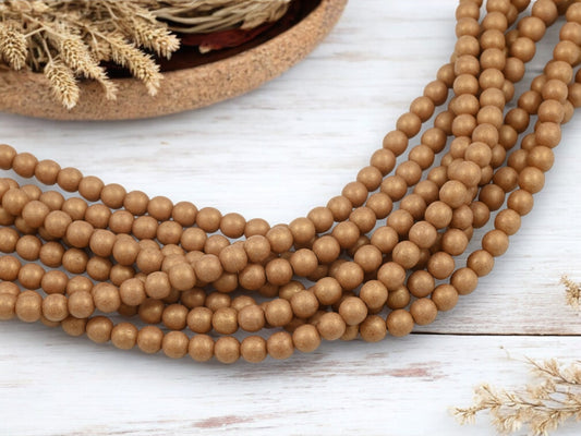 *50* 6mm Macademia Pacifica Round Druk Beads