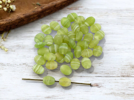 *50* 7x9mm Matte Spring Green Swirl Flat Oval Beads