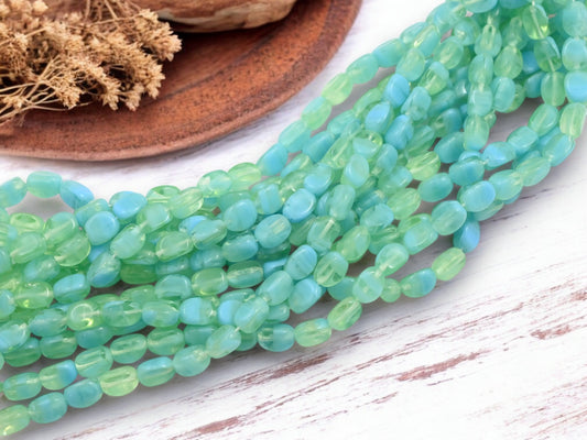 *25* 9x7mm Blended Blue Laguna Tri Oval Beads